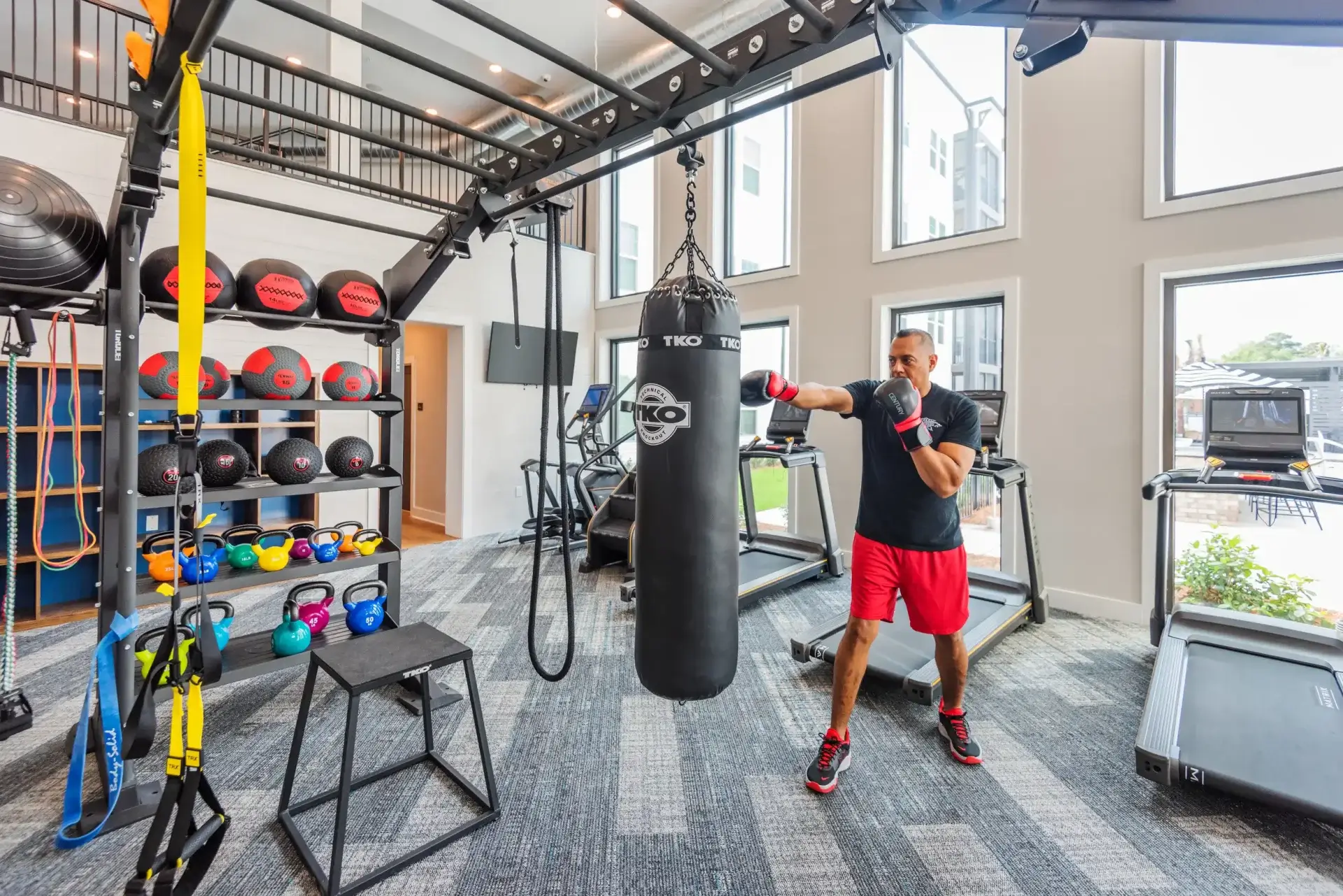 Resident staying active at The Lively Grande Dunes gym, featuring high-end equipment designed for personal growth.